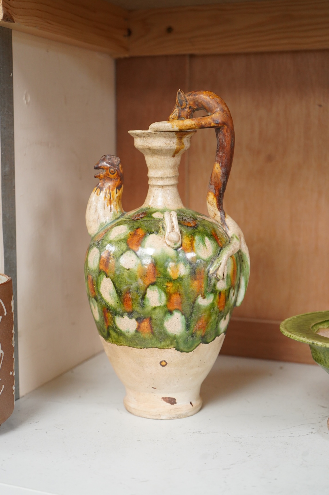 A Chinese agate ware flask, a sancai ewer and a stem dish, largest 26cm high